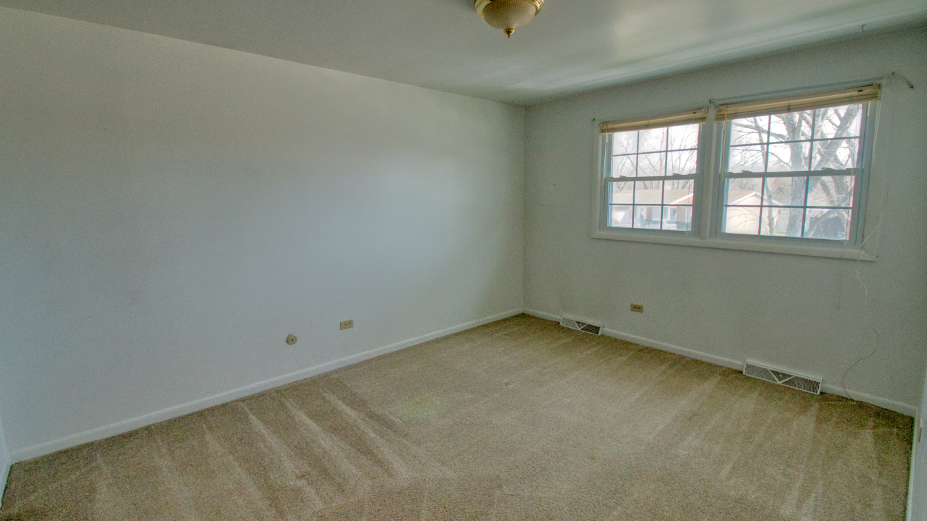 1200 Ridgeway Drive Elgin, IL 60123 - Photo 17 of 34 an empty room with a window
