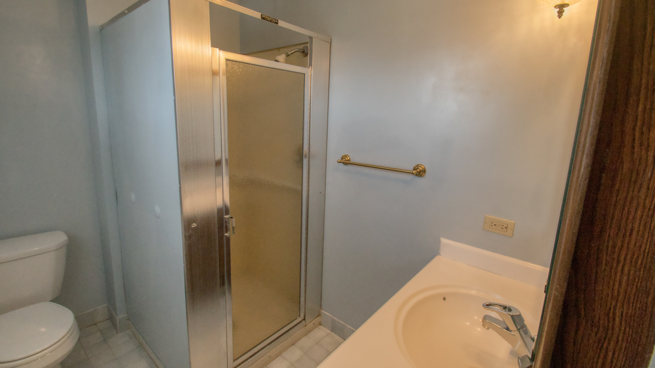 1200 Ridgeway Drive Elgin, IL 60123 - Photo 18 of 34 a bathroom with a sink and toilet