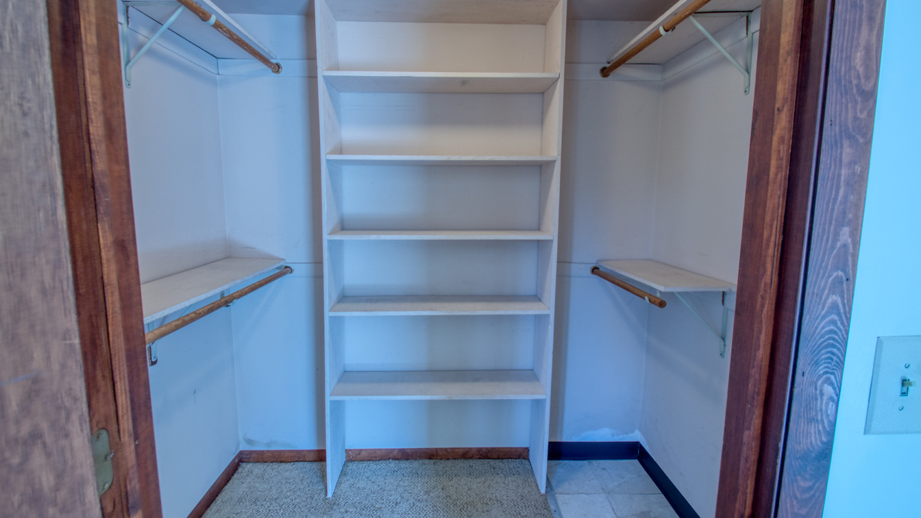 1200 Ridgeway Drive Elgin, IL 60123 - Photo 19 of 34 a view of walk in closet with empty racks