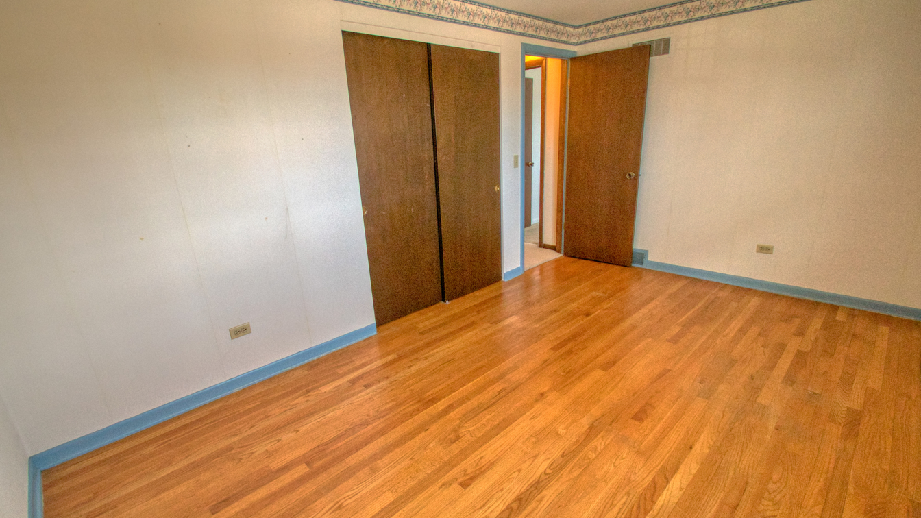 1200 Ridgeway Drive Elgin, IL 60123 - Photo 20 of 34 a view of empty room with wooden floor and fan