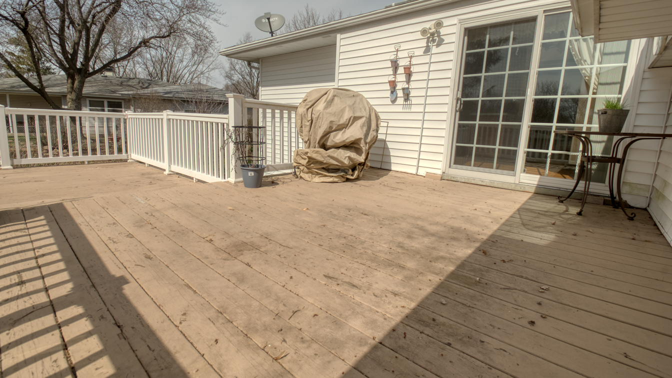 1200 Ridgeway Drive Elgin, IL 60123 - Photo 33 of 34 a view of a backyard with table and chairs and wooden floor