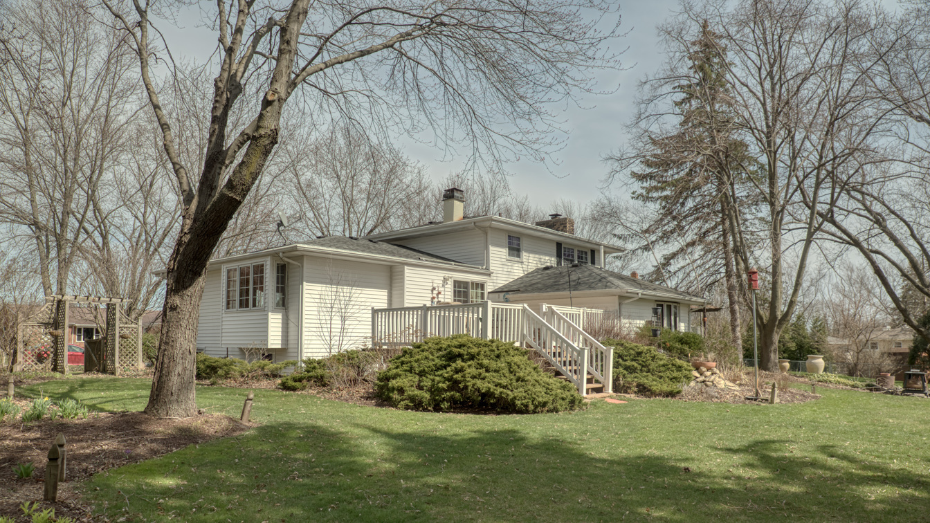 1200 Ridgeway Drive Elgin, IL 60123 - Photo 4 of 34 a front view of a house with a yard