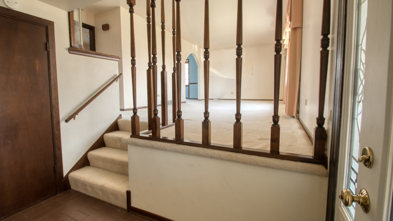 1200 Ridgeway Drive Elgin, IL 60123 - Photo 8 of 34 a view of staircase with lots of white walls