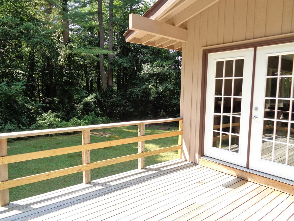 10 River Road Sturbridge, MA 01566 - Photo 12 of 29 a view of a balcony with wooden floor and windows
