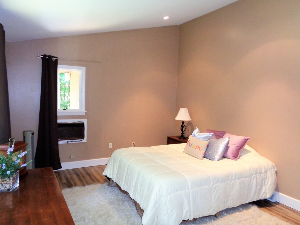 10 River Road Sturbridge, MA 01566 - Photo 14 of 29 a bedroom with a bed and a window