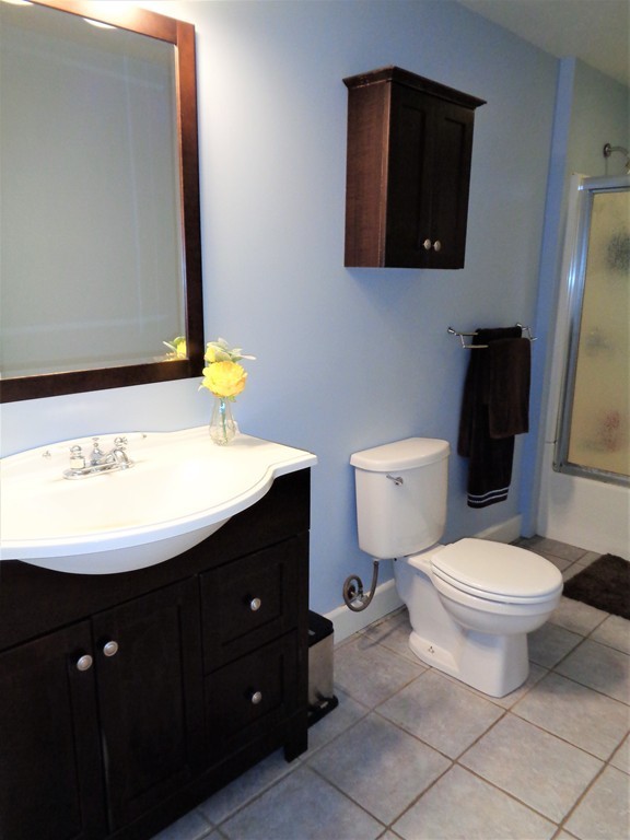 10 River Road Sturbridge, MA 01566 - Photo 16 of 29 a bathroom with a sink toilet and mirror