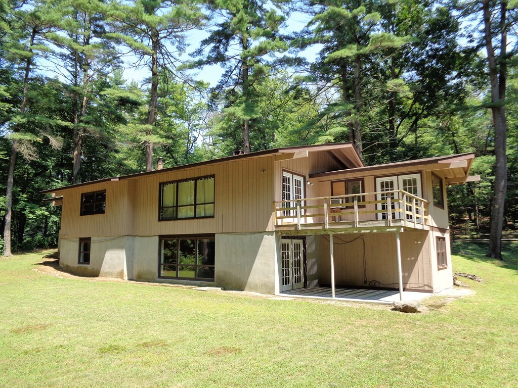 10 River Road Sturbridge, MA 01566 - Photo 2 of 29 a front view of a house with a yard