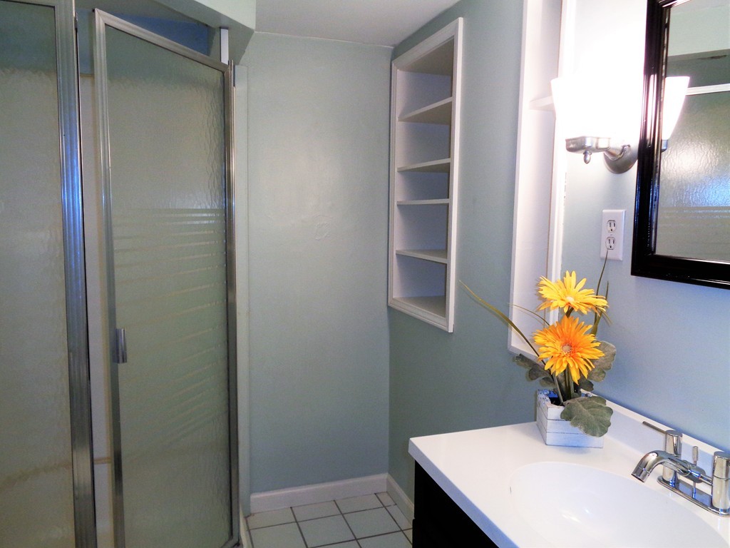10 River Road Sturbridge, MA 01566 - Photo 21 of 29 a bathroom with a sink a toilet and a mirror