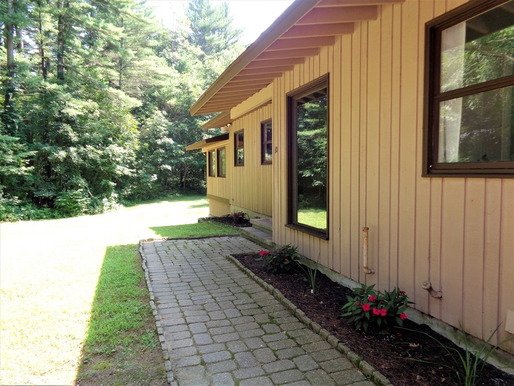 10 River Road Sturbridge, MA 01566 - Photo 25 of 29 a front view of a house with a yard