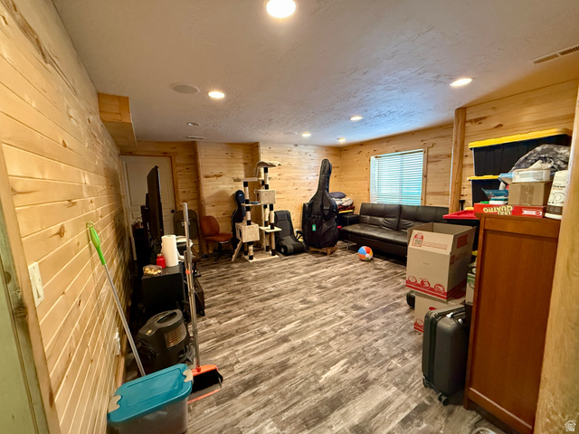 1353 360 West Payson, UT 84651 - Photo 12 of 16 Spacious room featuring wood plank wall finishes and textured flooring