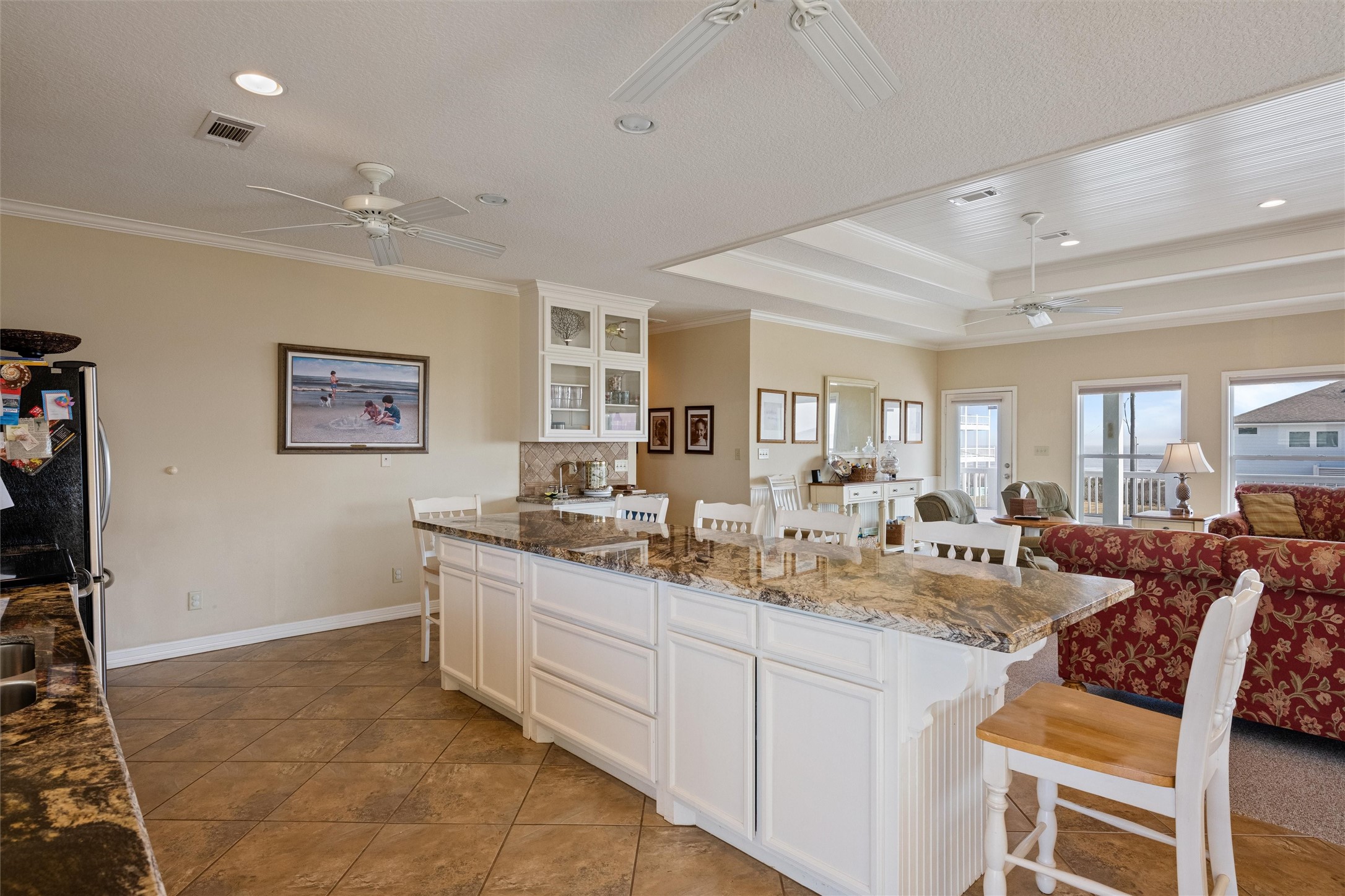 3125 James Street Crystal Beach, TX 77650 - Photo 17 of 45 a large white kitchen with a large window