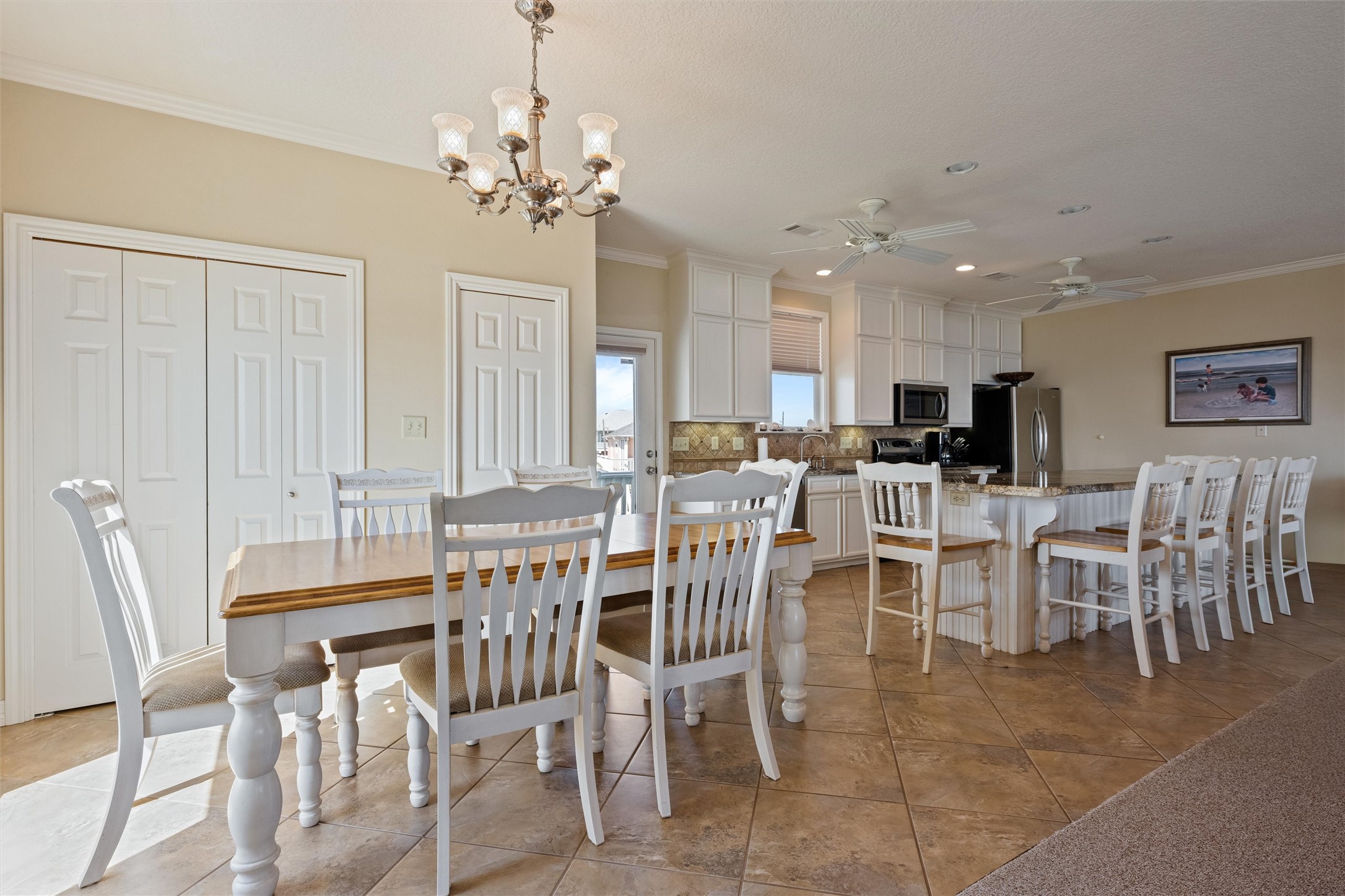 3125 James Street Crystal Beach, TX 77650 - Photo 20 of 45 a view of a dining room with furniture and chandelier