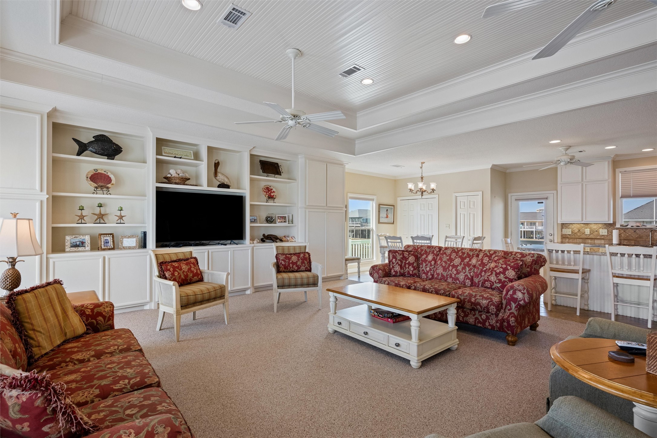 3125 James Street Crystal Beach, TX 77650 - Photo 24 of 45 a living room with furniture and a flat screen tv