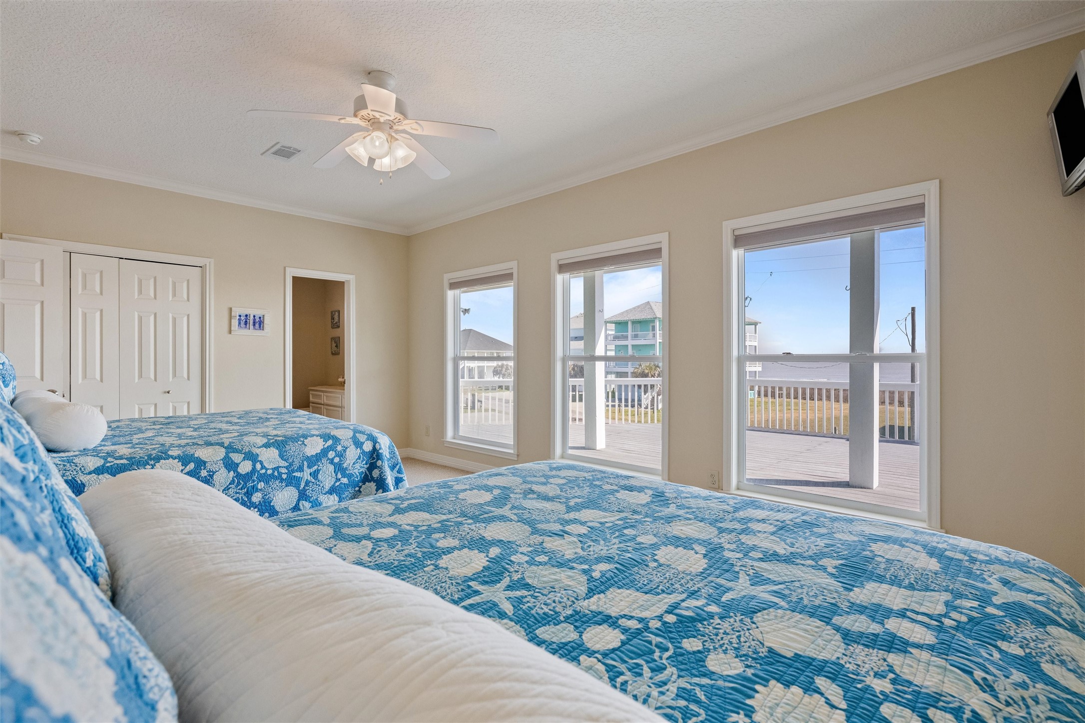 3125 James Street Crystal Beach, TX 77650 - Photo 27 of 45 a bedroom with a large bed and a window