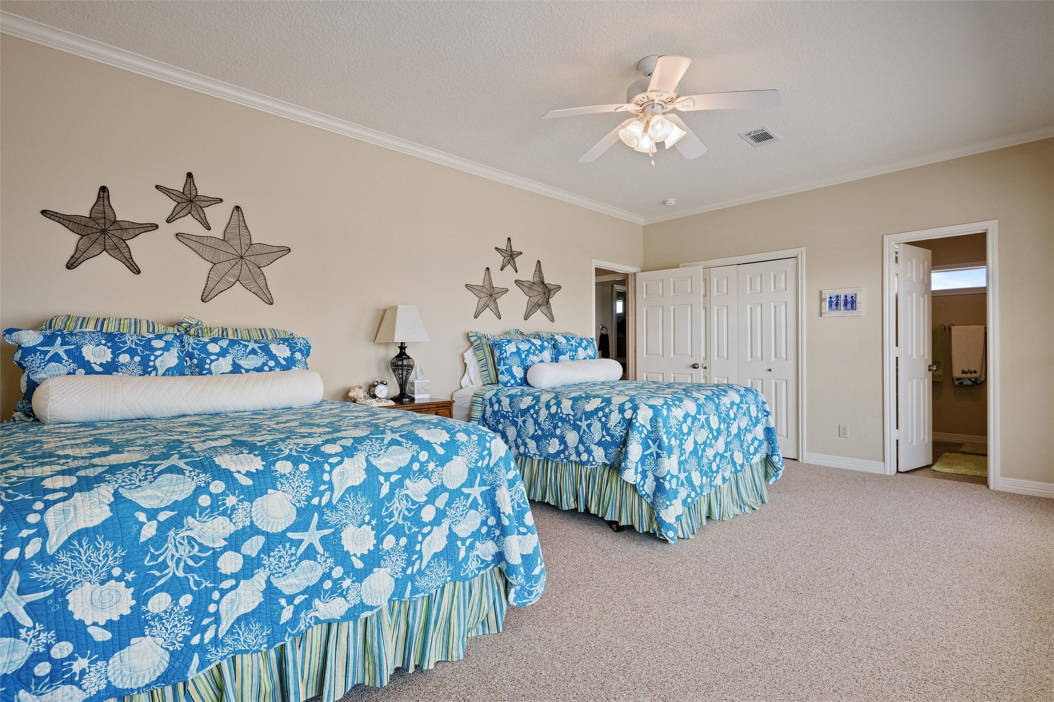 3125 James Street Crystal Beach, TX 77650 - Photo 28 of 45 a bedroom with bed and a chandelier