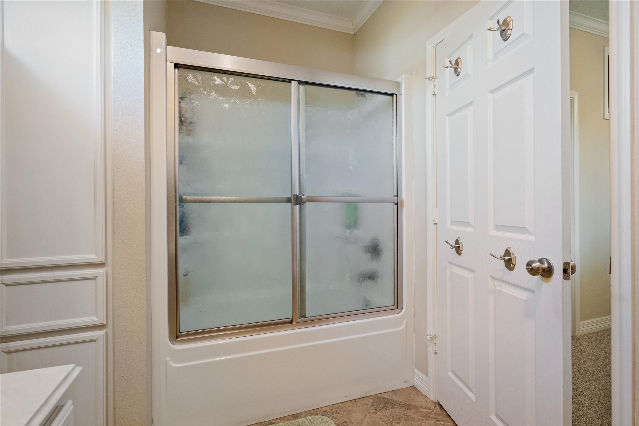 3125 James Street Crystal Beach, TX 77650 - Photo 34 of 45 a bathroom with a glass shower door