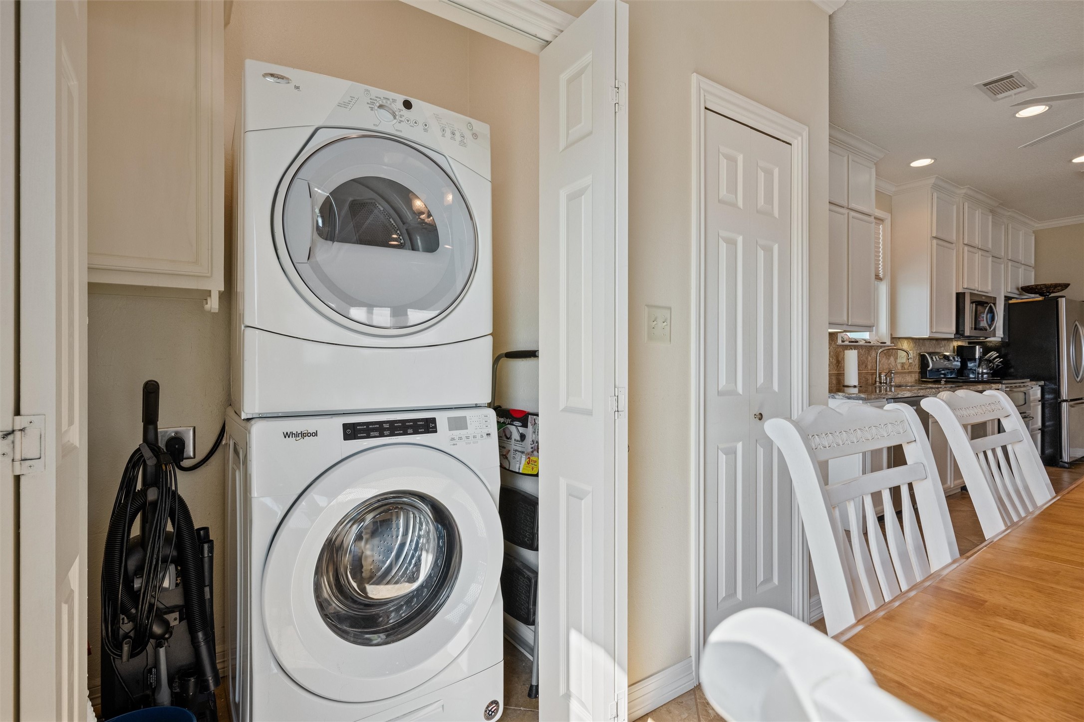 3125 James Street Crystal Beach, TX 77650 - Photo 39 of 45 a view of a hallway with washer and dryer
