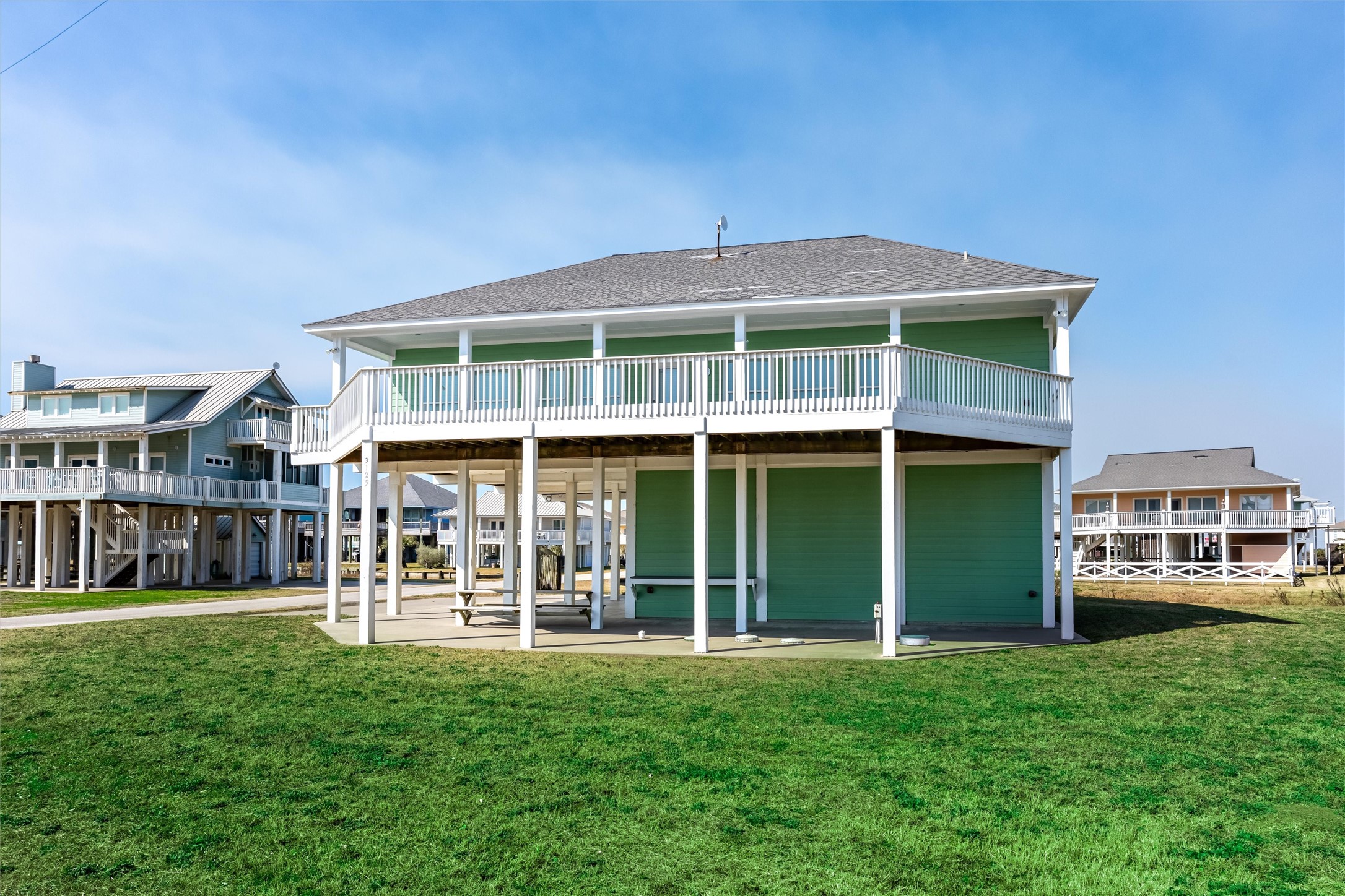 3125 James Street Crystal Beach, TX 77650 - Photo 7 of 45 a front view of a house with a yard