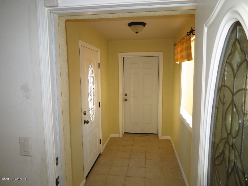 12234 North Table Top Road Maricopa, AZ 85139 - Photo 43 of 50 Hall connecting house to garage