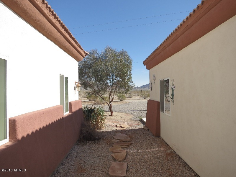 12234 North Table Top Road Maricopa, AZ 85139 - Photo 44 of 50 Hall to garage exit