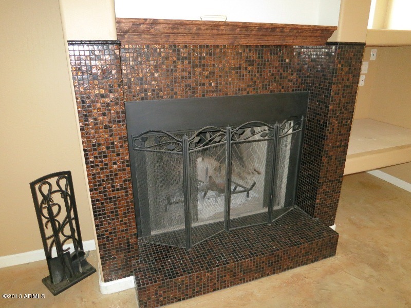 12234 North Table Top Road Maricopa, AZ 85139 - Photo 8 of 50 Family room- fireplace