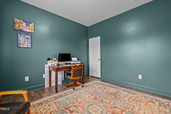 a workspace with furniture and a window