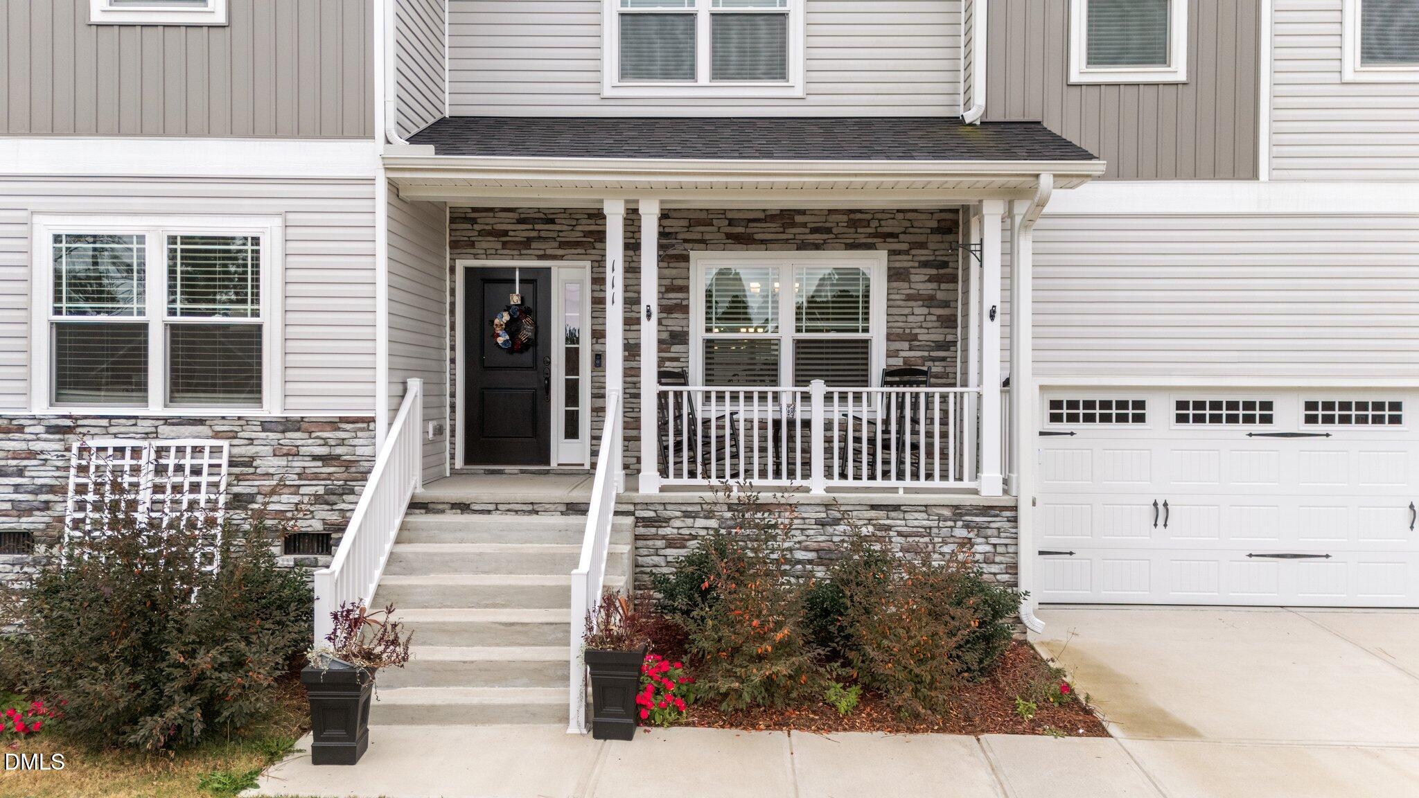 111 Spring Flowers Drive Cameron, NC 28326 - Photo 2 of 31 a front view of a house with a yard