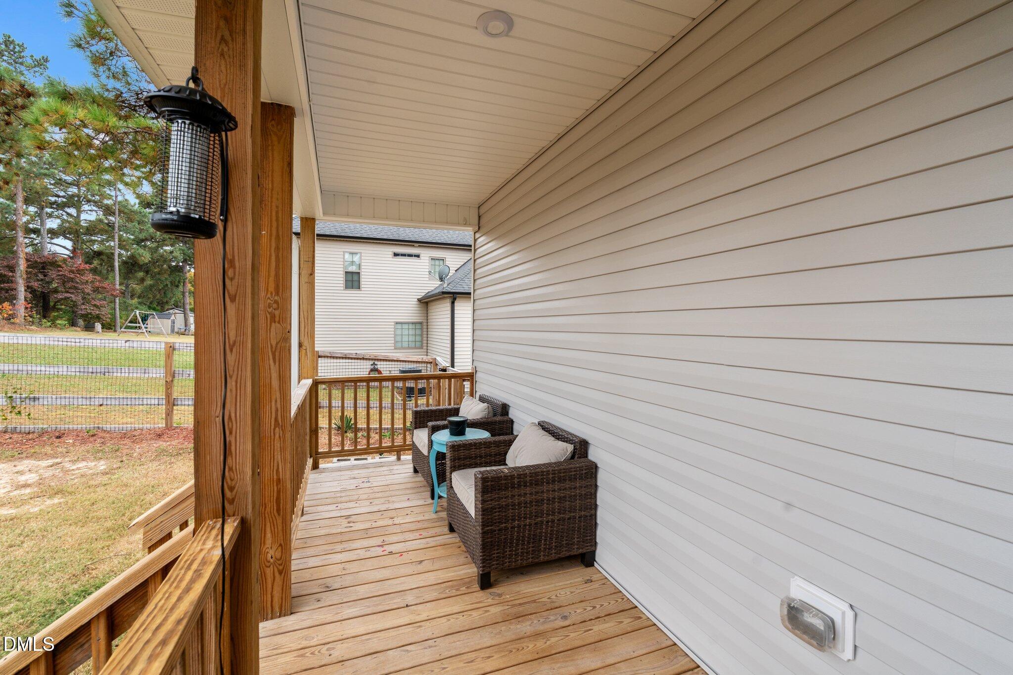 111 Spring Flowers Drive Cameron, NC 28326 - Photo 27 of 31 a view of a balcony with wooden floor
