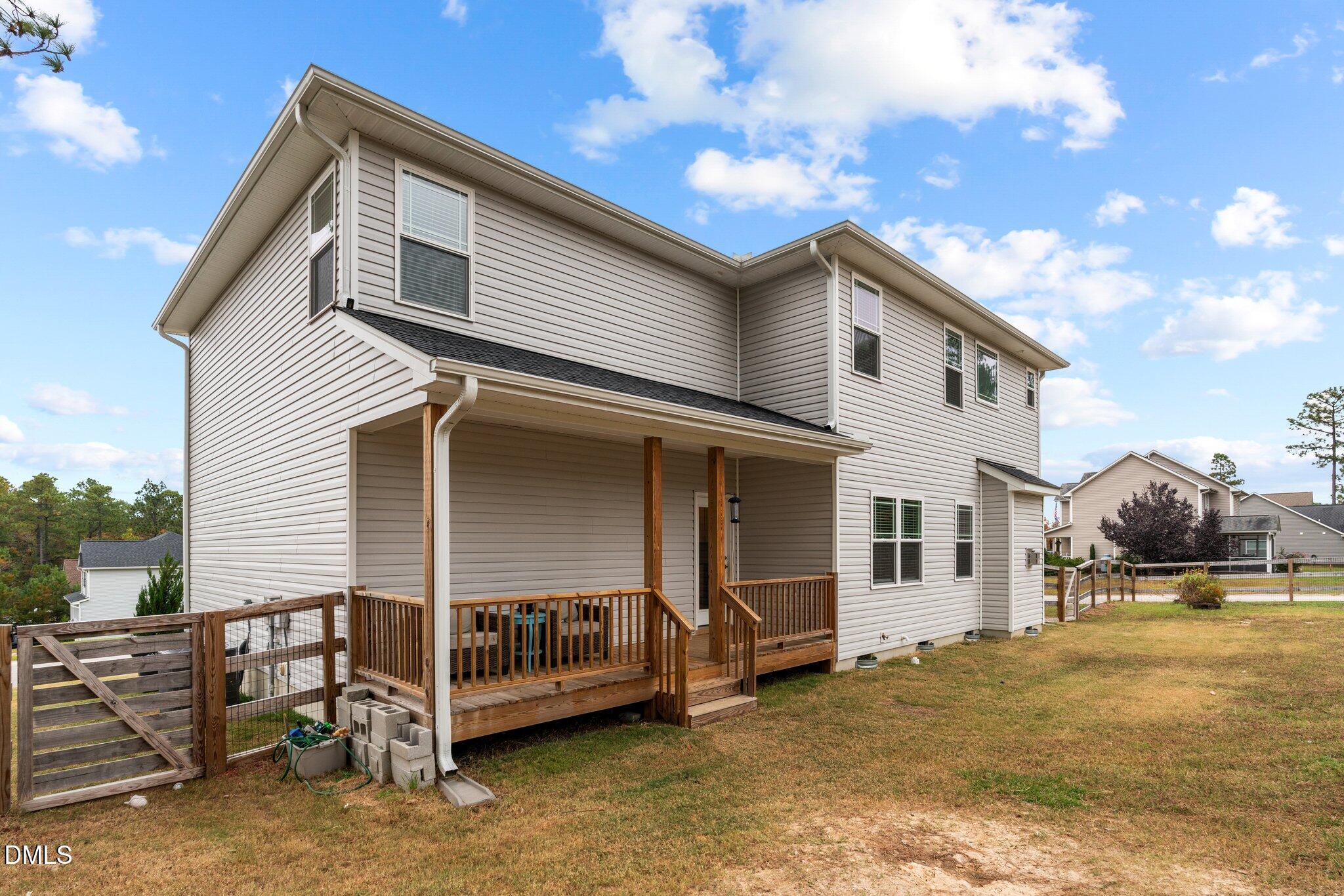 111 Spring Flowers Drive Cameron, NC 28326 - Photo 28 of 31 a view of a house with a balcony