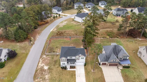 an aerial view of residential houses with outdoor space