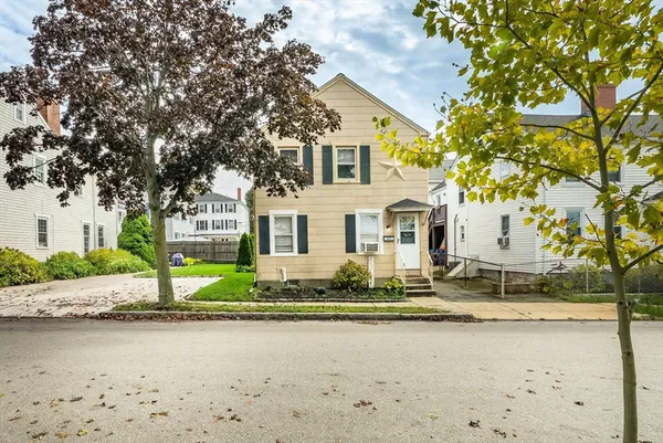 a view of a house with a yard