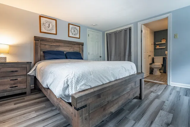 a bedroom with a bed and a closet