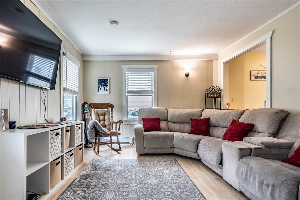 17 Middle Street Fairhaven, MA 02719 - Photo 3 of 18 a living room with furniture and a flat screen tv