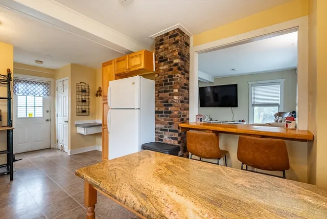 a large bedroom with a bed and a flat screen tv