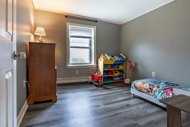 a bedroom with bed and a window