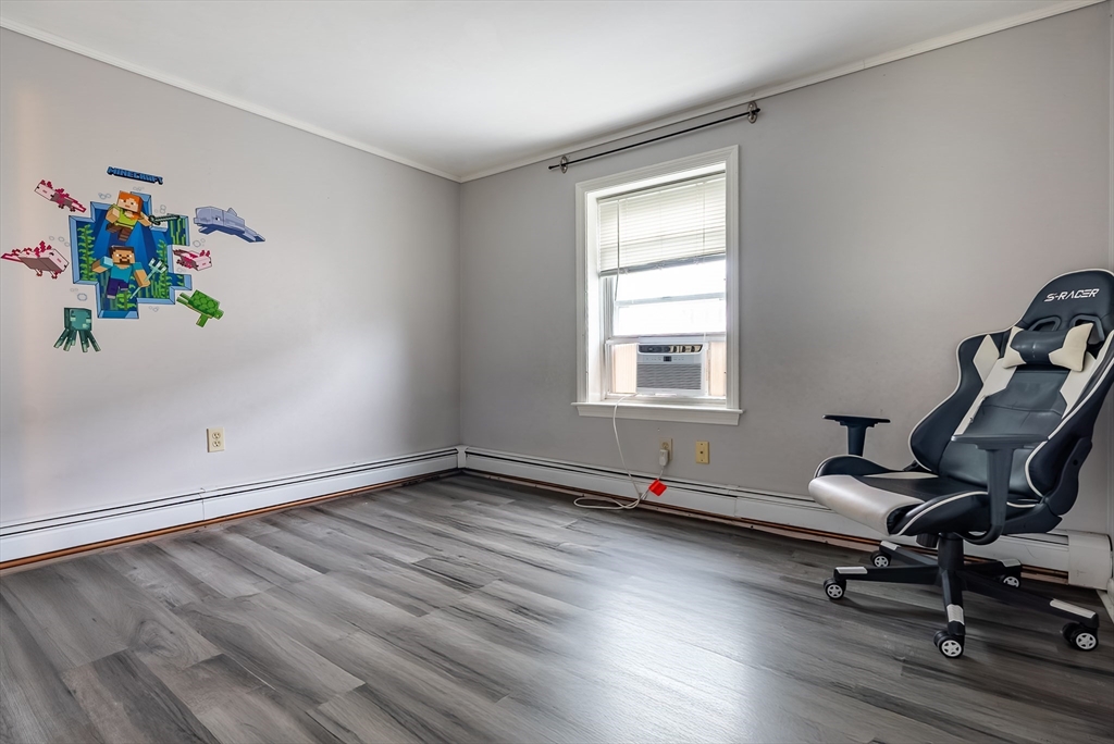 17 Middle Street Fairhaven, MA 02719 - Photo 10 of 18 a view of a room with gym equipment on wooden floor