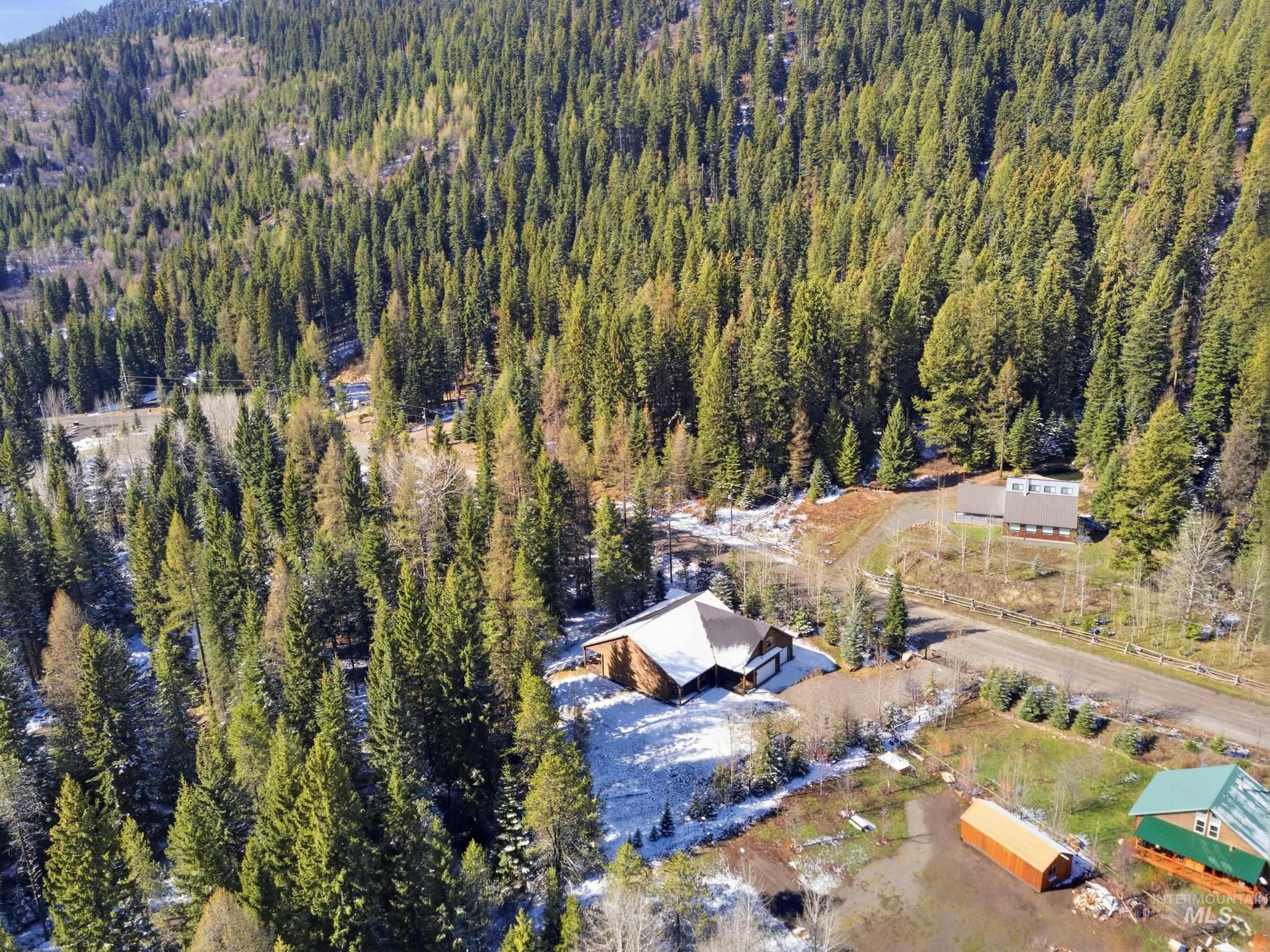 2538 West Mountain Road Donnelly, ID 83615 - Photo 41 of 50 Wooded mountain landscape featuring multiple structures