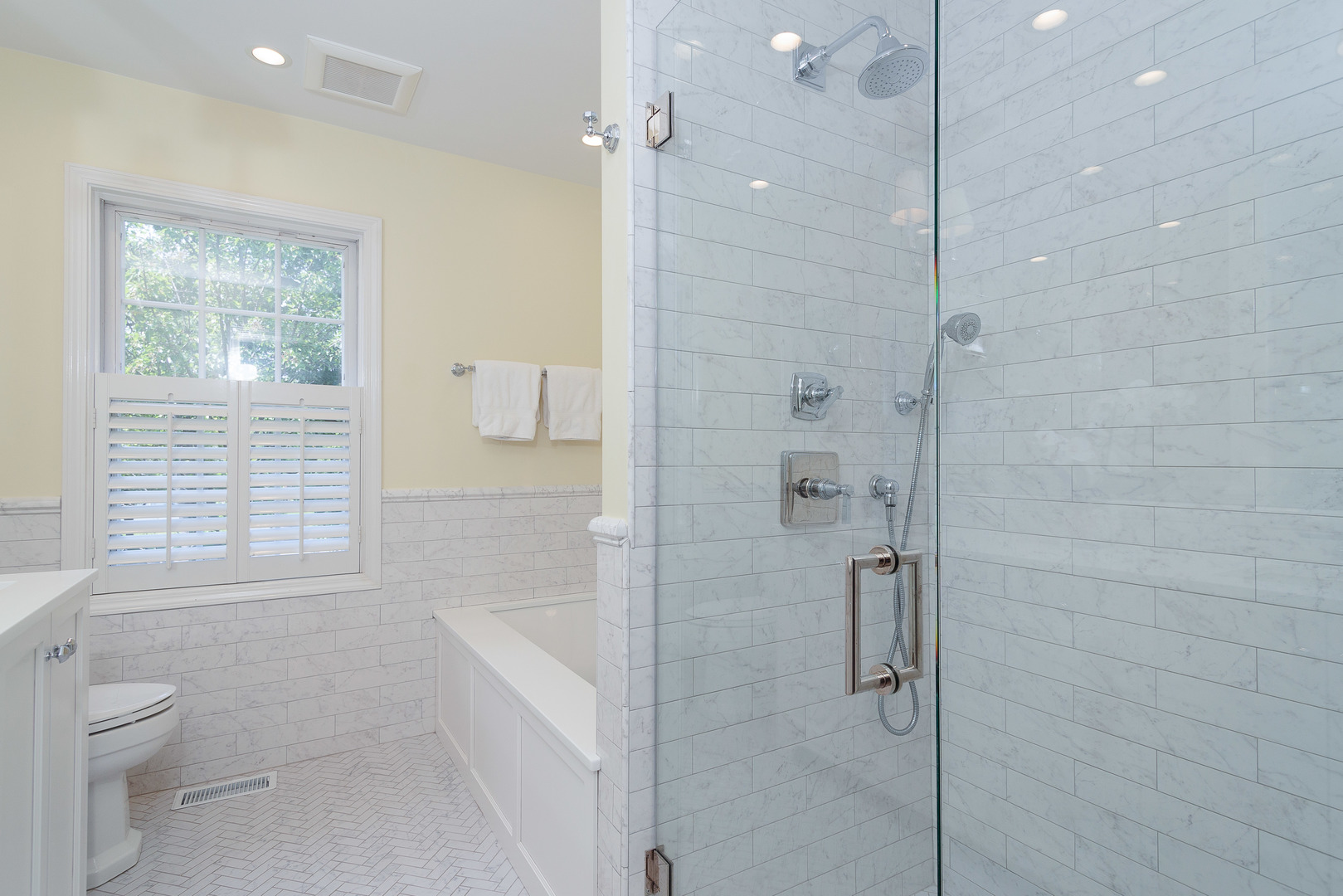 559 Rockefeller Road Lake Forest, IL 60045 - Photo 13 of 50 a bathroom with a granite countertop shower a toilet and a sink