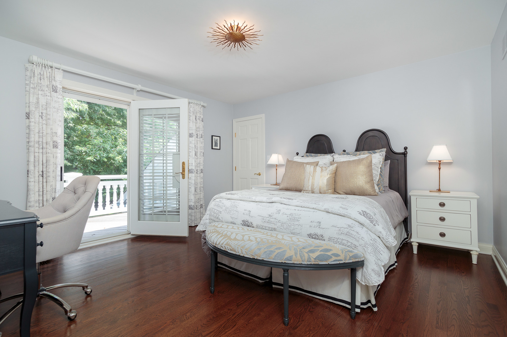 559 Rockefeller Road Lake Forest, IL 60045 - Photo 19 of 50 a bedroom with a large bed and wooden floor