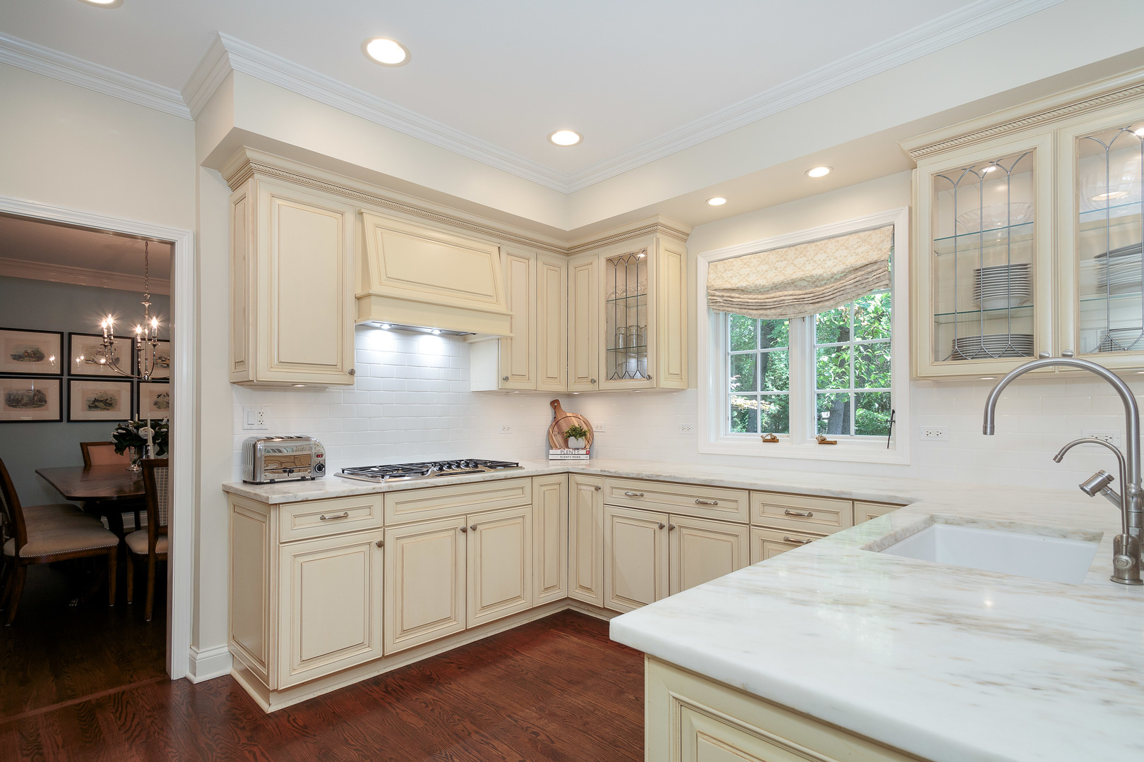 559 Rockefeller Road Lake Forest, IL 60045 - Photo 6 of 50 a kitchen with a sink stove and cabinets