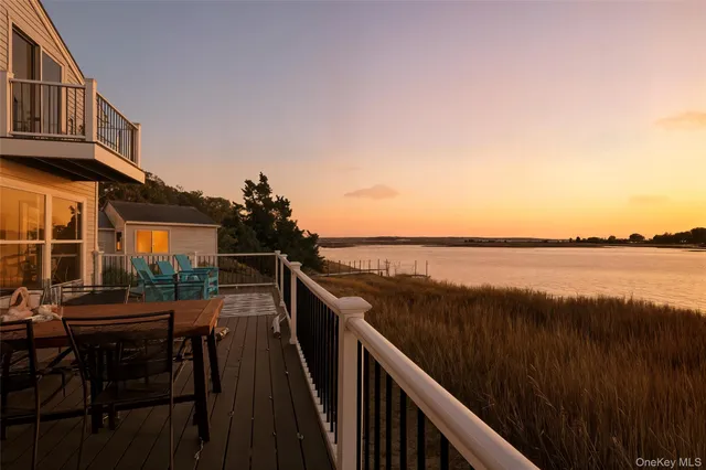 a balcony with wooden floor and outdoor space