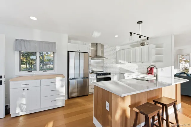 a kitchen that has a cabinets a sink and appliances