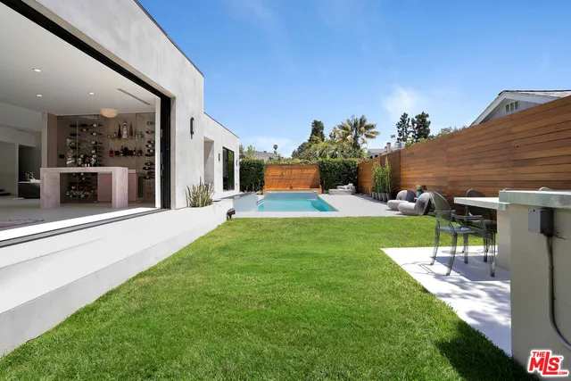 a view of a house with a yard porch and sitting area