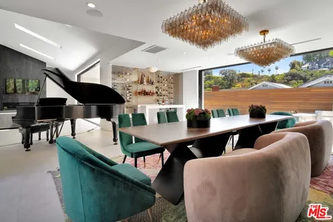a view of a dining room with furniture window and outside view