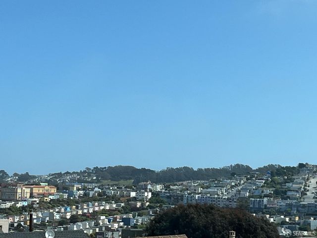a bedroom with bed and window