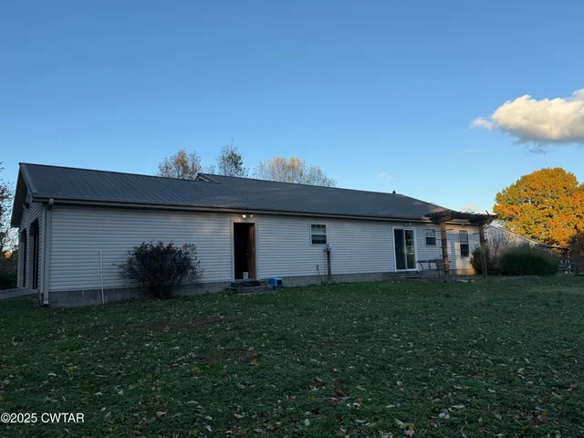 a backyard of a house with lots of green space