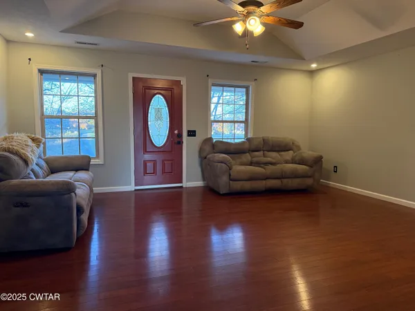 a living room with furniture and a window