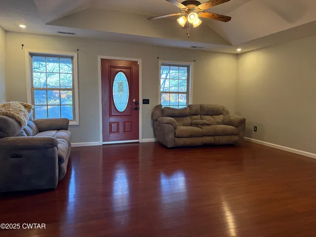 a living room with furniture and a window