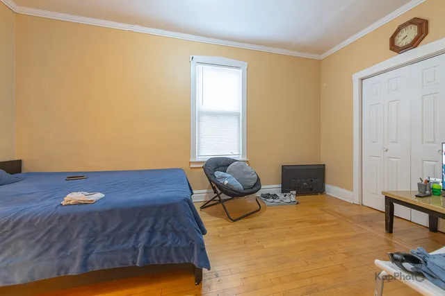 a kitchen with stainless steel appliances granite countertop a refrigerator and wooden cabinets