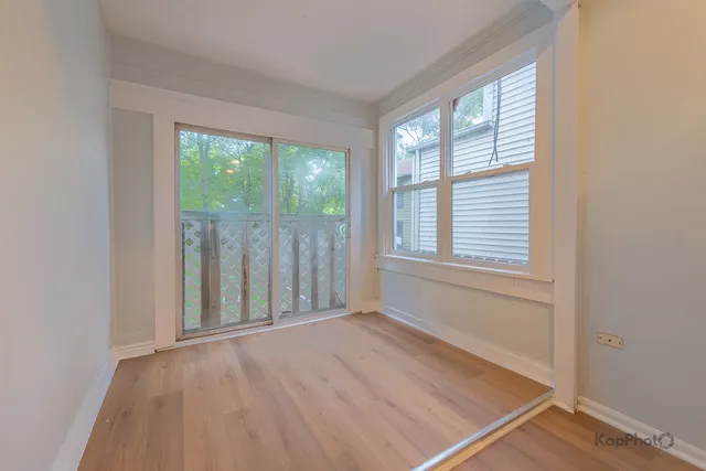 a kitchen with a sink cabinets stainless steel appliances and a window